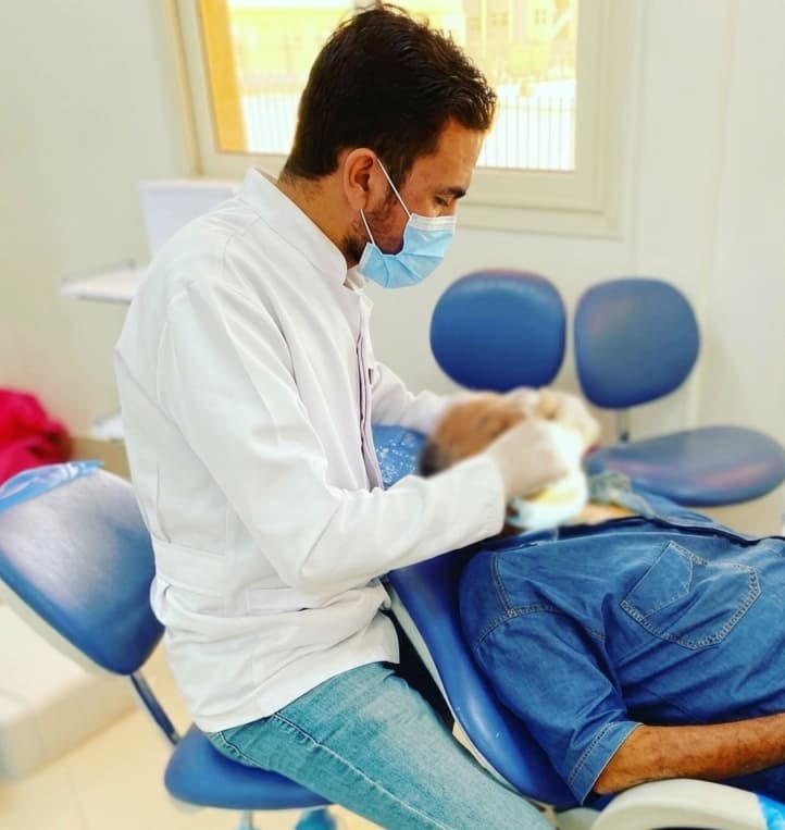 Dr. Amr Mohamed treating a patient at his clinic
